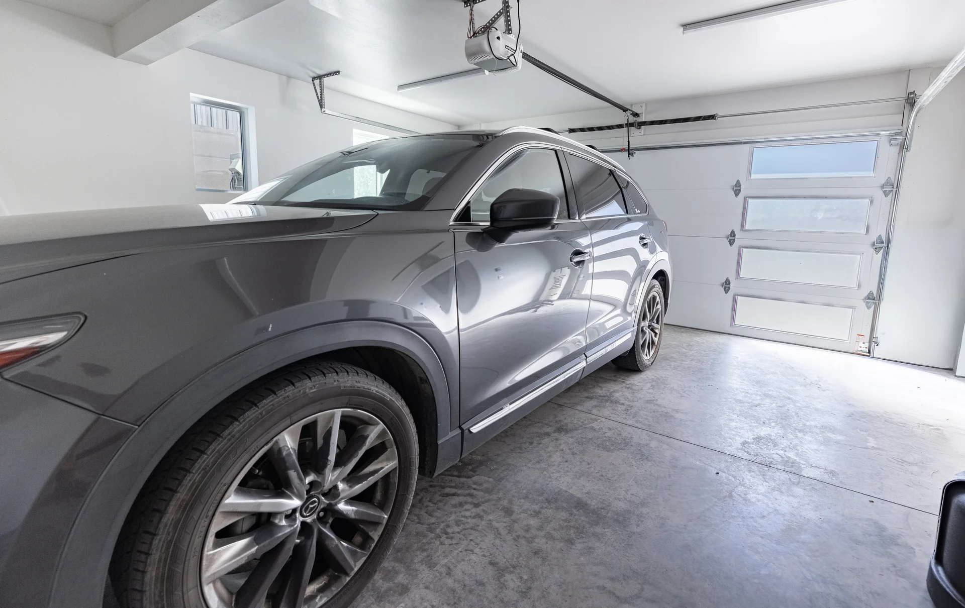 Attached two-car garage with finished concrete floor and natural light
